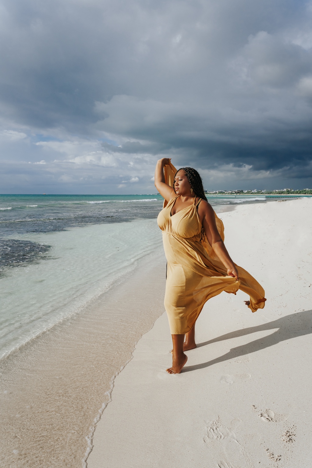 Christina Lane standing at the meeting point of ocean and shore